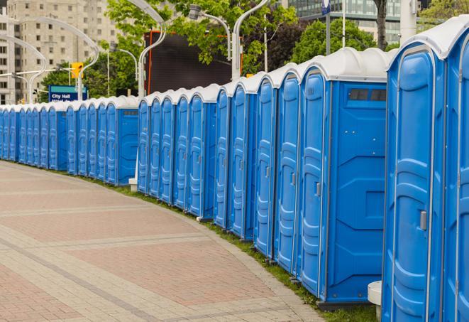 a row of portable restrooms set up for a special event, providing guests with a comfortable and sanitary option in Cumberland